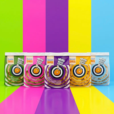 Eccentric Bagel Mini Bagel Chips in five flavors including Sea Salt, Cheddar Burst, Everything, Cinnamon Raisin Brown Sugar Crunch, and Garlic Herb Obsession