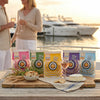 Mini bagel chips packaging on a table with people and boats in the background