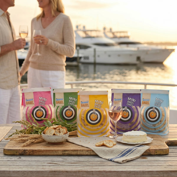 Mini bagel chips packaging on a table with people and boats in the background